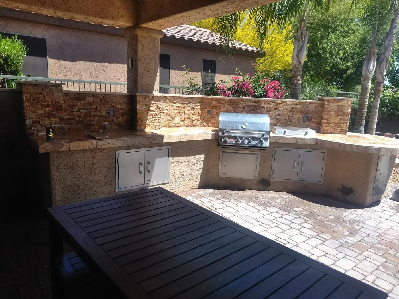 Covered outdoor kitchen and dining area