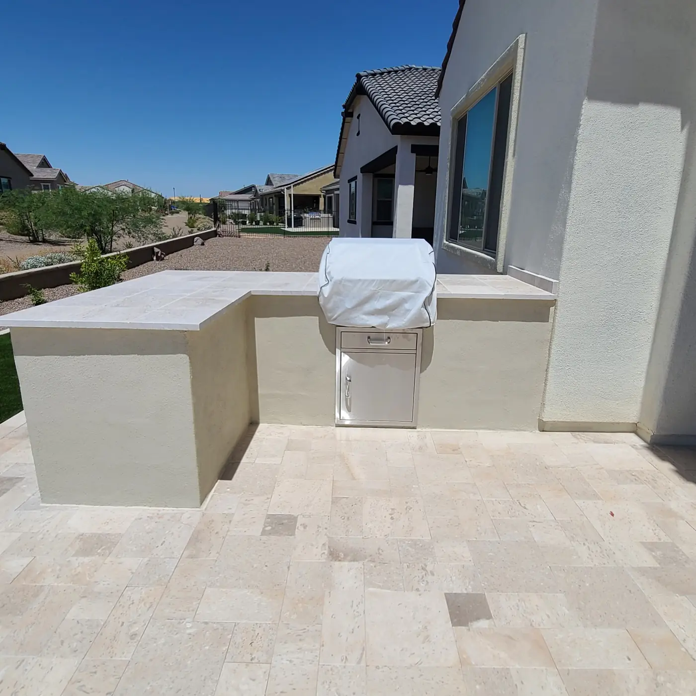 Custom BBQ island and stone patio