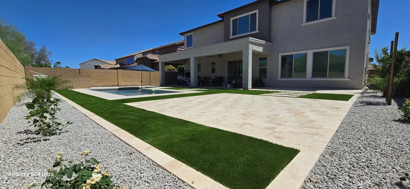 Large patio with geometric turf accents