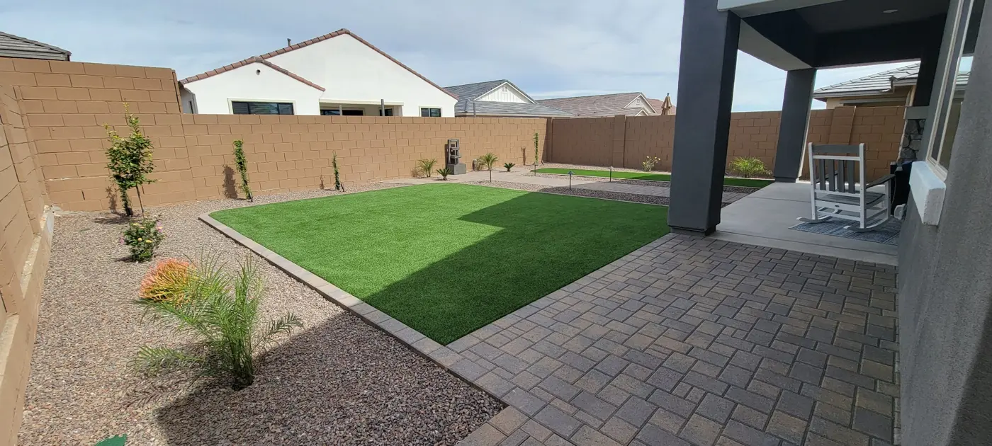 Paver patio with turf and planting areas