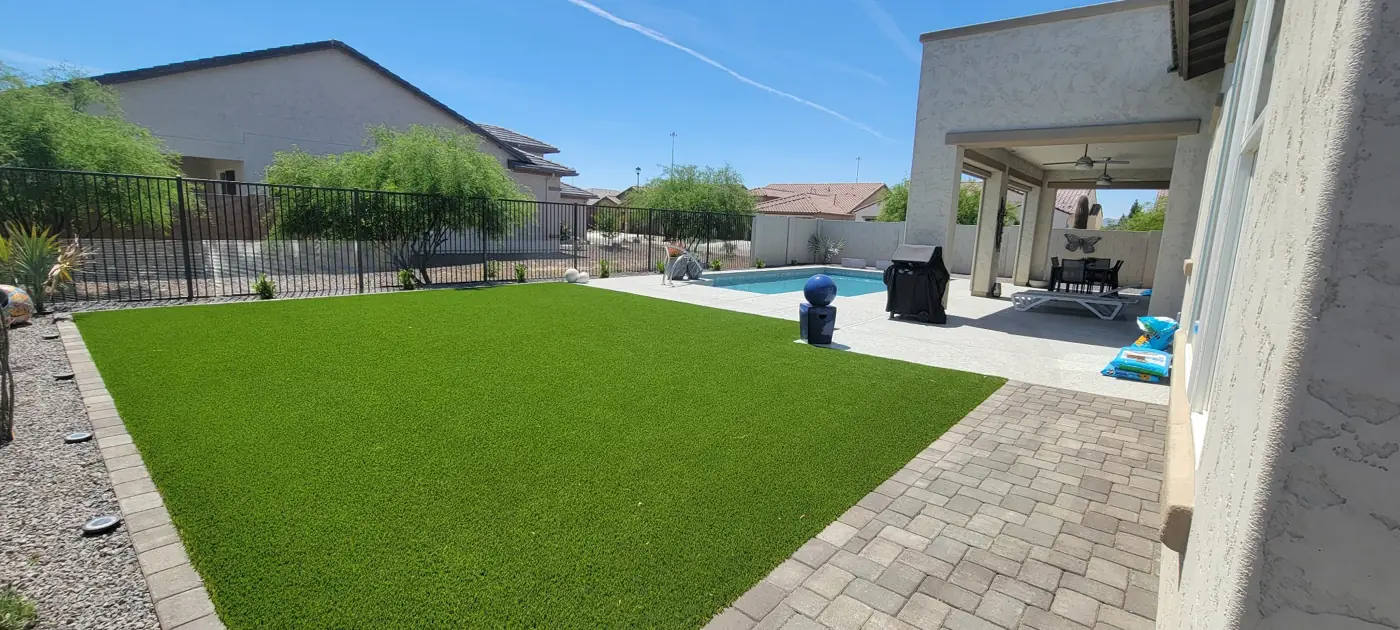 Backyard turf, patio and pool layout by L & R