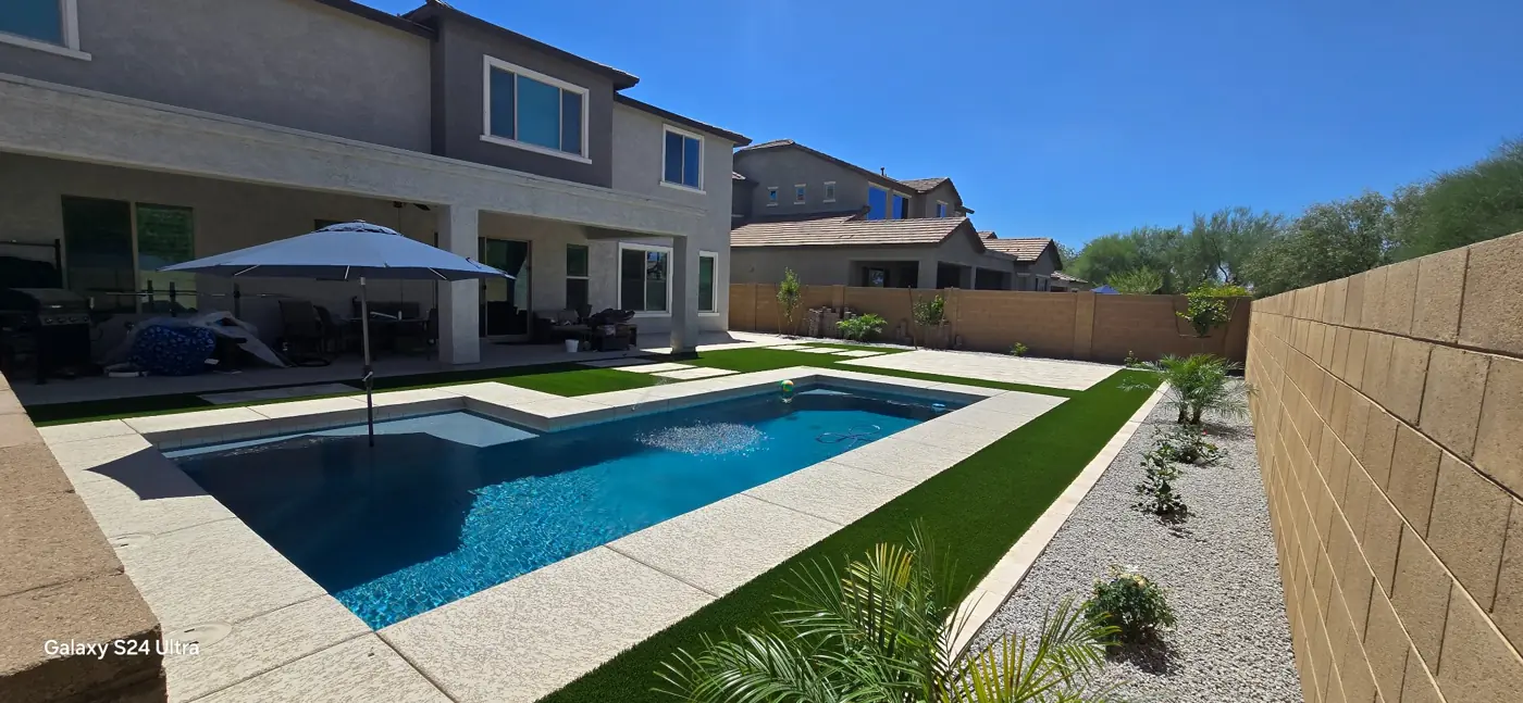 Pool, turf and paver decking by L & R