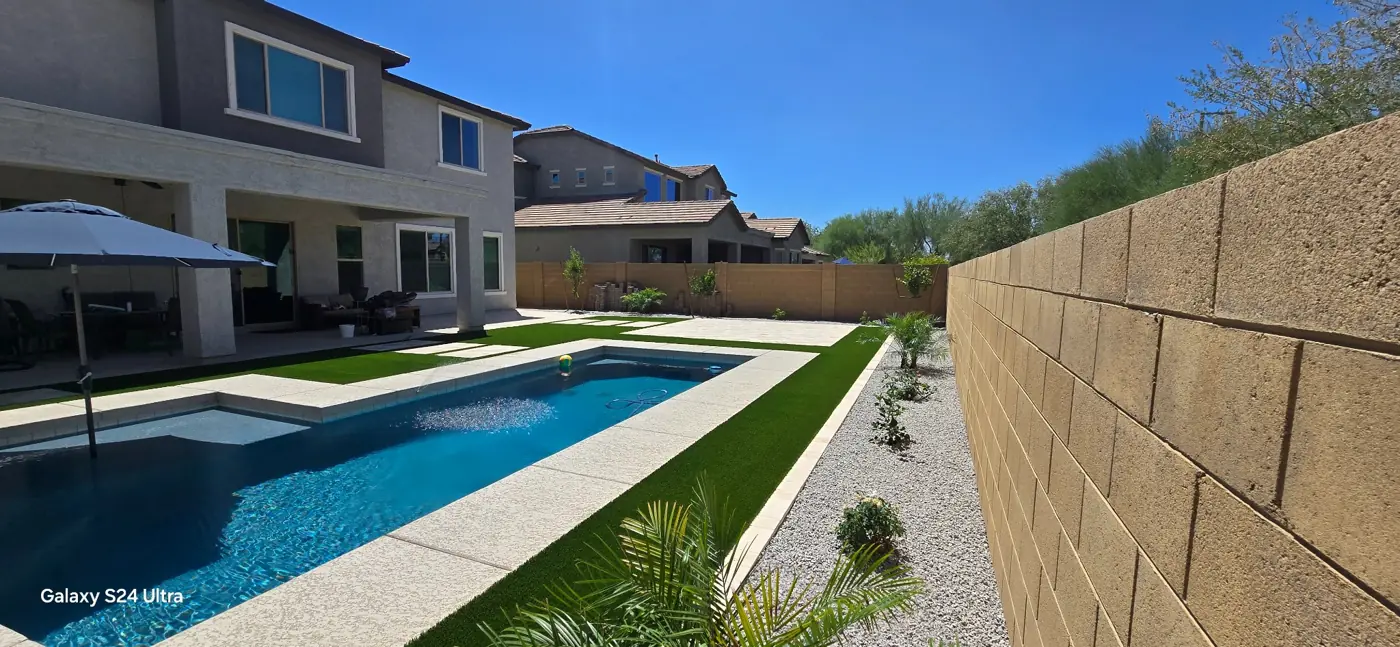 Poolside decking and landscape border by L & R